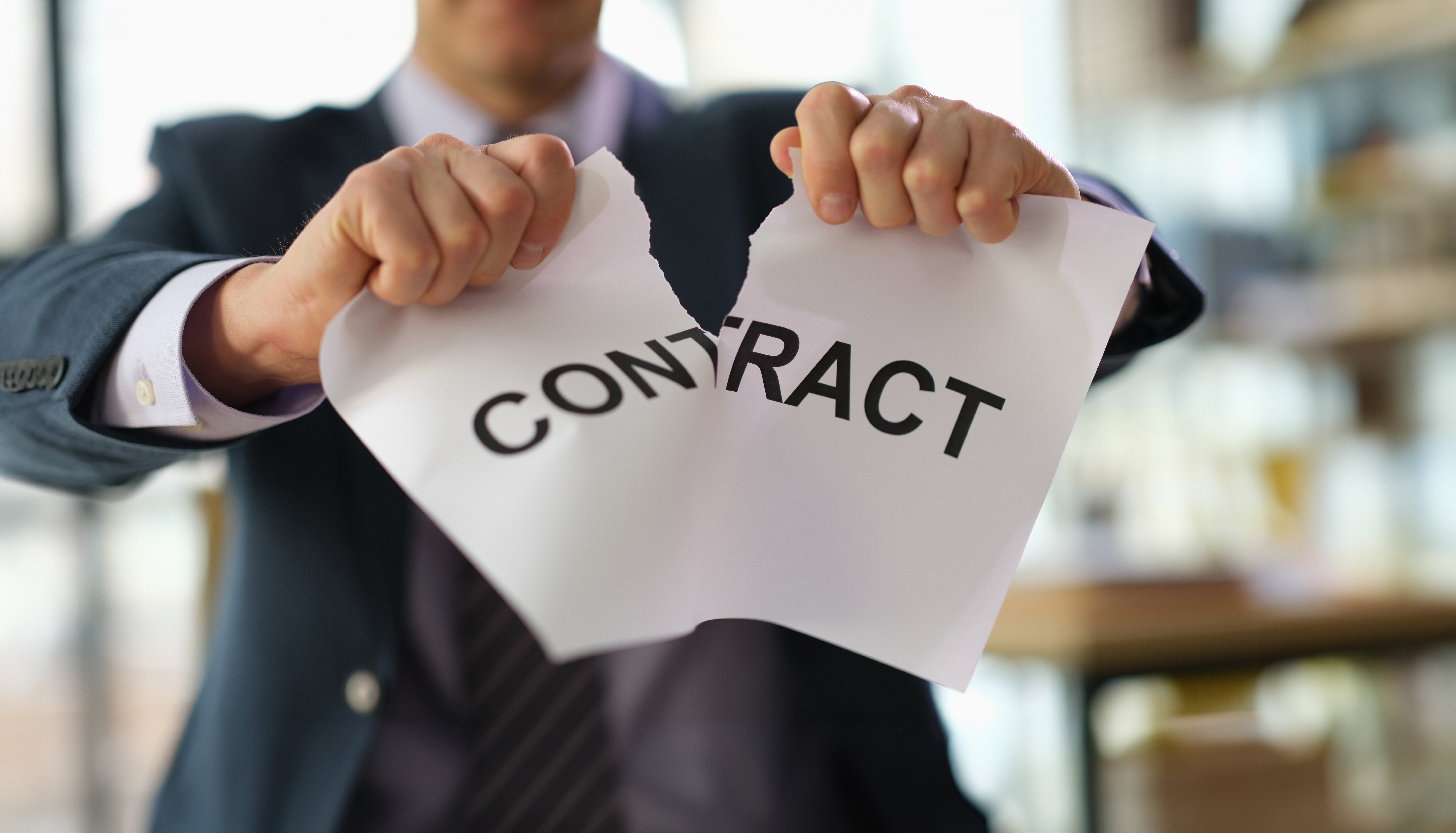 Businessman,In,Suit,Tearing,Paper,Document,Contract,At,Work,In